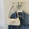 Bolso de axila de nicho estilo francés 2026 nuevo modelo bolso de mano simple bolso de hombro de moda bolso cruzado bolso pequeño para mujer