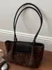 Elegante bolsa de mano de gran capacidad estilo francés para principios de otoño 2026, bolso de hombro de nicho, alta costura, elegante, bolsa ligera para el hombro