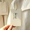 Fábrica FSC Nova Tendência Ecológica Etiqueta de Papel com Cheiro de Grama Personalizada Etiqueta de Roupa Artística