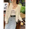Chaqueta Cardigan de Punto Blanco para Mujer Otoño/Invierno 2026 Nuevo Holgado Casual Moda Versátil Prendas Exteriores Suéter Top