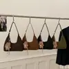 Bolsa de Mão Versátil Casual da Moda Bolsa Bolinho para Mulheres 2025 Inverno Nova Elegante de Ombro/Axila de Alta Qualidade