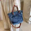 Bolso Cubo Texturizado de Mezclilla Desgastada Estilo Coreano Primavera Verano 2026 Nuevo Versátil Casual Pequeño Bandolera