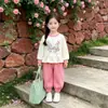 Conjunto Feminino Primavera Outono 2026 Novo Estiloso Menina Bebê Casual Roupas de Outono Conjunto de Duas Peças com Moletom e Calça