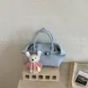 Bolso de Cubo Simple Portátil Estilo Coreano Transfronterizo para Mujer 2026 Primavera Nuevo Bolso de Hombro Cruzado Retro de Alta Calidad