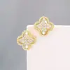 Pendientes de botón Ins de alta calidad, súper brillantes, con forma de trébol de cuatro hojas de la suerte, de circonita, para mujer, moda coreana y japonesa, nuevos pendientes de temperamento de lujo ligero