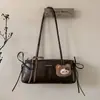 Bolsa Retro Fashion para Mulheres 2026 Novo Estilo Simples Nicho Elegante Bolsa de Ombro a Tiracolo Versátil Bolsa Baguete Tendência