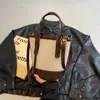 2026 Nuevo Bolso Cubo Patchwork para Mujer Bolso de Mano Retro con Bloques de Color Bolso Pequeño de Alta Gama Urbano Simple Casual Bolso Cruzado