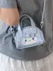 Mini bolso de mano lindo de estilo coreano con dibujos animados, lunares y lazo, bolso cruzado de nicho para niñas, adecuado para llevar lápiz labial y accesorios
