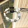 Pulseira com Caveira Manchada e Franjas Corrente Nacional Pedra Natural Cabeça de Gato Design de Nicho Pulseira Tecida à Mão Atacado