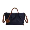 Bolsa de fuga personalizada estilo japonês, bolsa tote de nylon impermeável color block para mulheres, bolsa transversal de nicho fashion de grande capacidade