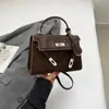 Bolso Kelly de Mano Retro Bolso Cruzado Bolso de Mujer de Venta Caliente Versátil de Gama Alta Bolso Cuadrado Pequeño Bolso de Hombro de Nicho para Viajero