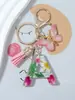 Suministros del Fabricante Llaveros con Flores Secas Prensadas 26 Letras del Alfabeto Inglés Llaveros con Borla de Mariposa Charms para Bolsos de Mujer