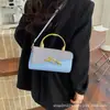 Bolso de Mano Nuevo para Mujer Verano 2026 con un Toque de Alta Gama, Lujo Ligero, Elegante Bolso Cuadrado Pequeño, Bolso Versátil de Moda, Venta al por Mayor de Bolsos para Mujer