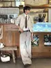 Pantalones casuales de traje a rayas con botones para hombre y mujer, nuevos de otoño vintage versátiles holgados que estilizan con caída y pierna ancha
