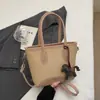 Bolso de mano tipo cubo nuevo de primavera 2026, transfronterizo, estilo vintage simple, de alta gama, moderno, para ir al trabajo, bolso de hombro cruzado de moda