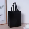 Bolsas no tejidas de color sólido aluminizadas laminadas en relieve transfronterizas al por mayor, bolsos de mano con logotipo impreso, bolsas de regalo, bolsas de compras