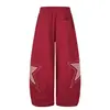 Pantalones casuales de moda juvenil para mujer 2026, nuevos, con patchwork de cinco estrellas decorado, corte regular, pierna curva, venta al por mayor desde una sola fuente, talla 34