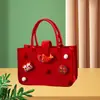 Bolsa de fieltro para regalo de Nochebuena Libro Rojo Mismo estilo Bolsa Mini de Manzana de Caramelo Bolsa para Empaque de Regalo Bolsa de Compras