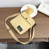 Bolsa para teléfono móvil de mujer, bolso pequeño cruzado, bolso mini de lona simple, bolso de hombro vertical versátil de moda, monedero para llaves y monedas