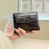 Daini Versión Coreana Nuevo Patrón Agrietado Color Sólido Simple Colgante de Lazo de Perla 80% de descuento Cierre de Cremallera Cartera Corta