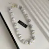 Collar de doble capa con cuentas acrílicas transfronterizo europeo y americano, cadena para la clavícula de lujo ligero de alta gama, joyería de estilo étnico vintage al por mayor