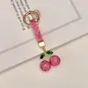 Artículo Popular Transfronterizo: Llavero de Cerámica Arcilla Cereza con Pedrería, Colgante para Llave de Coche, Dijes Brillantes de Cereza con Pedrería para Bolso, Llavero