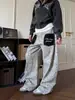 Jeans DSS de estilo retro americano con bolsillos de parche de estampado de leopardo para hombre y mujer, pantalones casuales holgados de pierna ancha curva estilo callejero
