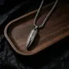 Collar exclusivo de acero inoxidable transfronterizo con cabeza de bala simulada, collar de hip-hop para hombre, accesorio versátil punk para pareja al por mayor