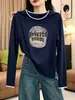La camiseta de manga larga de algodón puro más vendida de este año para mujer, una prenda elegante y versátil perfecta para usar en capas en otoño, con un diseño único y moderno.