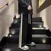 Pantalones largos de rayas de otoño nuevos transfronterizos de alta calle, pantalones de pierna ancha rectos holgados de moda, pantalones casuales deportivos a la moda