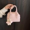 Bolsa de mão portátil simples de moda com textura estilo coreano primavera casual 2025 casual estilo ocidental design de nicho bolsa travesseiro