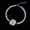 Transmisión en vivo nuevo collar elegante de rosa hueca socialité Camelia micro incrustada anillo abierto traje de pulsera de diamantes completos