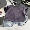 Conjunto de Ropa de Verano Nuevo para Niños 2026, Bebé Pequeño Estampado de Calor de Verano Cuello Redondo Manga Corta Ropa de Mezclilla Moderna Venta al por Mayor