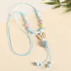 Collar con colgante de campana de mariposa de cerámica de estilo étnico retro para mujer, diseño nuevo y moderno, cadena larga para suéter, accesorios