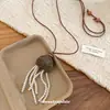 Nuevo Collar de Perlas con Borla de Corazón de Fruta Estilo Chino, Cadena para Suéter Retro Étnica de Lujo Ligero de Gama Alta con un Diseño Único para Mujeres de Nicho