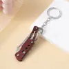Cuchillo de fruta de acero inoxidable para camping al aire libre transfronterizo, cuchillo plegable EDC portátil para llevar en cabina, llavero, color