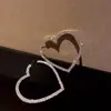Brincos de coração vazados com diamantes em toda a superfície, estilo personalidade Europa e Estados Unidos, atmosfera exagerada, brincos de moda de luxo, brincos populares da moda, atacado