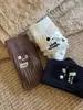 Otoño e invierno Nuevos calcetines de moda para mujer de punto grueso europeo con bordado de cara sonriente estilo ins japonés coreano a media pantorrilla calcetines de algodón clásicos