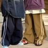 Pantalones casuales de pierna ancha para niños Primavera 2024 Estilo coreano versátiles pantalones deportivos de rayas pantalones deportivos para niños