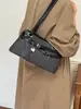 Elegante y simple moda 2026 nuevo bolso de hombro de gran capacidad versátil de nicho para mujer para el otoño y para ir al trabajo