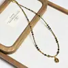 Collar transfronterizo estilo Melard de ojo de tigre y acero de titanio, vintage, nicho, alta gama, cadena de clavícula con cuentas, cadena versátil para suéter