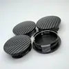 Adequado para a calota da roda original do carro para substituir a calota central integrada de fibra de carbono simulada com um diâmetro externo de 57MM e um diâmetro interno de 50MM para Xinma Zhida