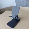 Soporte para teléfono móvil al por mayor, de escritorio multifuncional portátil plegable ajustable actividad regalo juguete venta al por mayor transfronteriza
