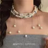 Colar de corrente de pérolas com borlas multicamadas retrô francês senso sênior temperamento de jantar acessórios de corrente de clavícula exagerados atacado