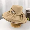 Nuevo sombrero de goma negro para mujer de Primavera y Verano sombrero para viajar sombrero para el sol para viajes sombrero para el sol para ocio al aire libre sombrero para el sol con lazo