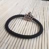 Liga de goma negra duradera de alta elasticidad para el cabello cola de caballo alta simple resistente accesorios de dibujos animados anillo para el cabello