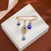 Broche de Borla Ojo del Diablo con Pedrería Creativa Europeo y Americano para Mujer, Pin de Estilo Vintage para Ceñir la Cintura de Suéter Ojo Azul de Alta Gama