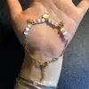Pulsera de Perlas de Moda Verano Nuevo Pequeña Fresca Concha Estrella de Mar Piedra Ojo de Gato Pulsera de Estilo Vacacional Simple de Gama Alta
