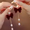 Brincos de Pérola com Laço Vermelho para Outono e Inverno Brincos de Luxo Femininos 2025 Novo Estilo Chinês Brincos Vermelhos