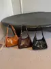 2026 Nueva Bolsa de Axila de Cuero Encerado Retro para Mujer Diseño de Nicho de Alta Gama Bolso de Hombro Único Versátil para Viajar Bolso Cruzado